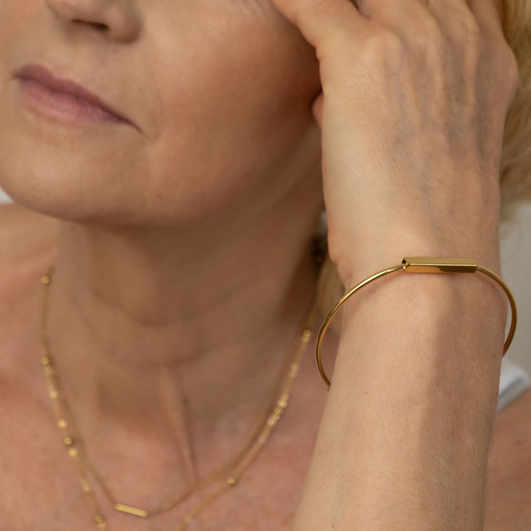 Sztywna cienka bransoletka stalowa pozłacana