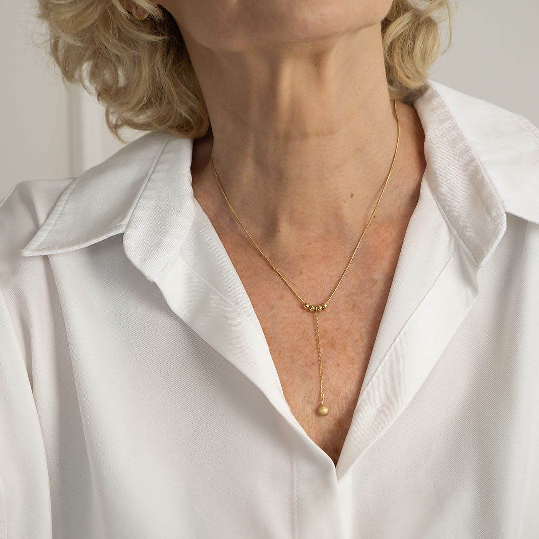 Naszyjnik krawatka z kulkami pozłacana stal szlachetna