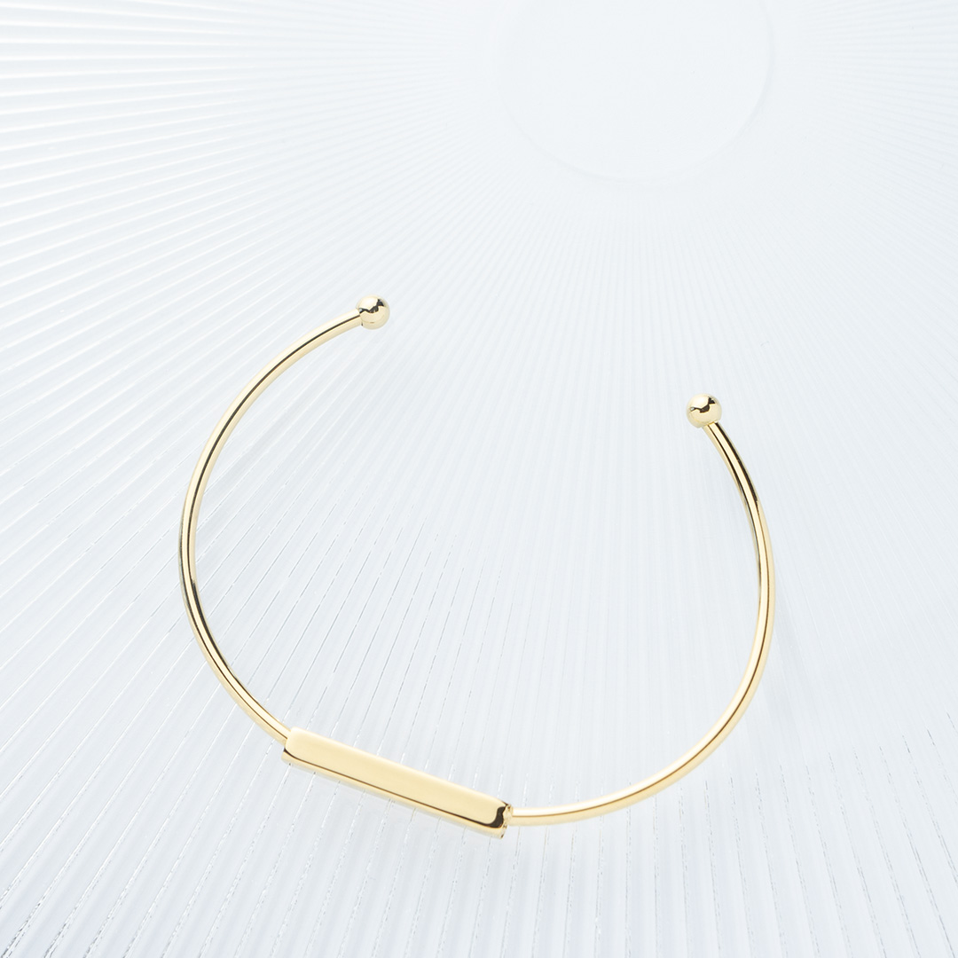 Sztywna cienka bransoletka stalowa pozłacana