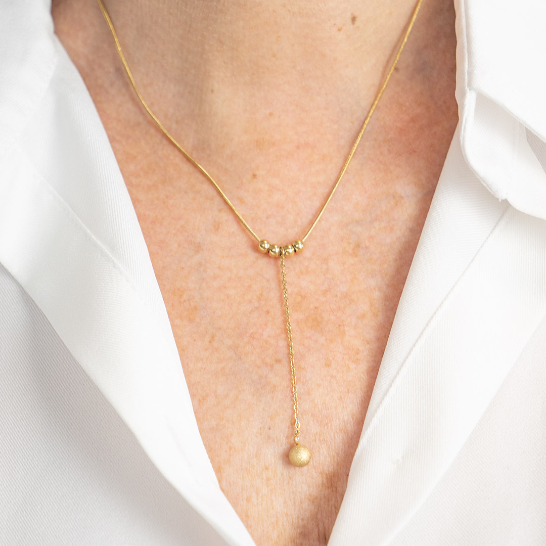 Naszyjnik krawatka z kulkami pozłacana stal szlachetna