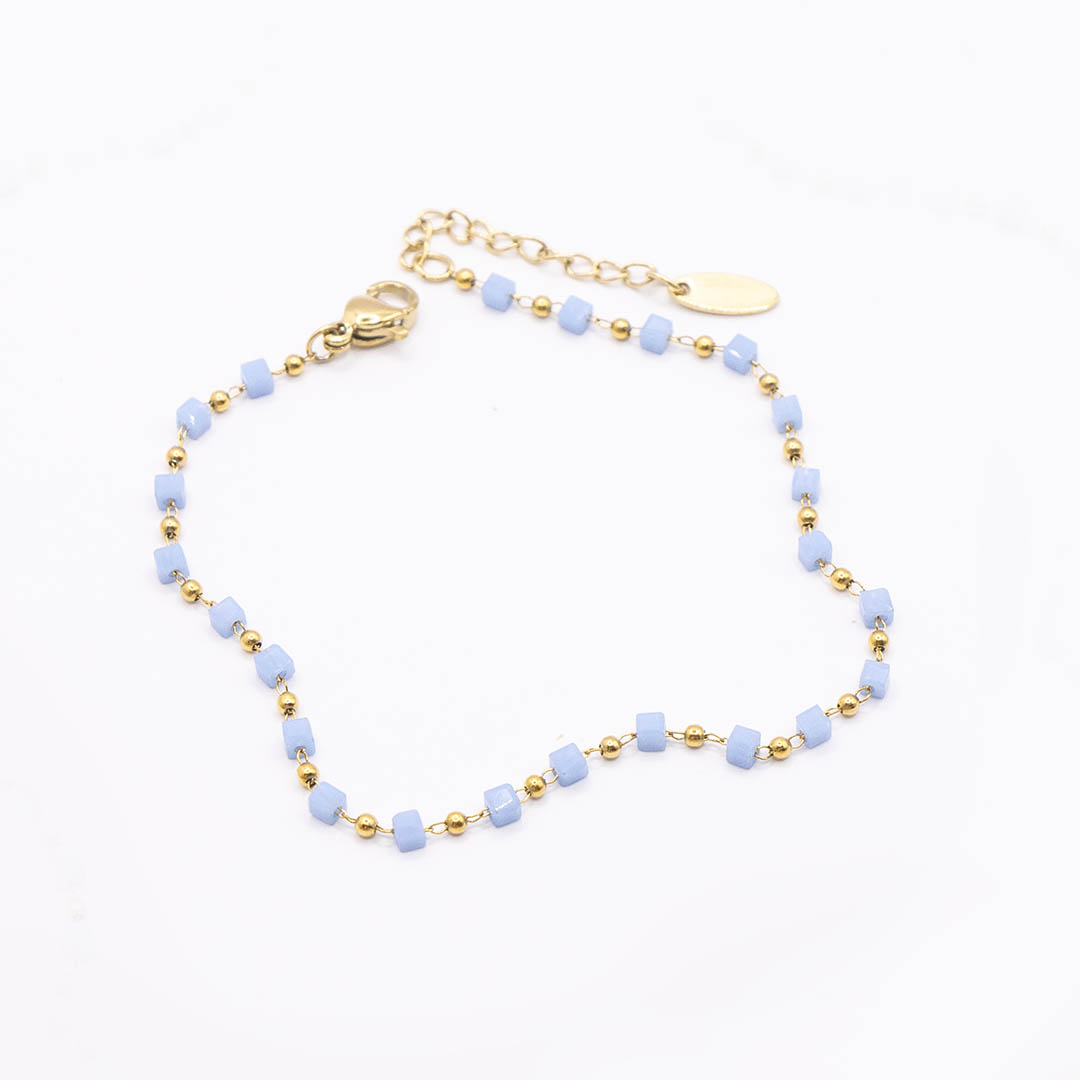 Bransoletka z niebieskimi koralikami pozłacana stal chirurgiczna